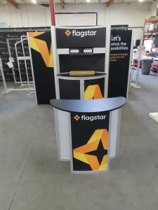 ECO-2018 Sustainable Exhibit with ECO-1065 Reconfiguration. Includes Aluminum Extrusion, Fabric Graphics ECO-5C Counter, Storage, and Meeting Area -- View 2